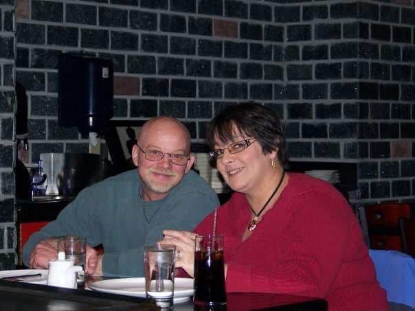 David and a woman sitting together at a restaurant